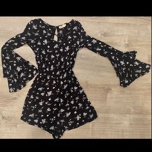 Hollister dress. Black Floral Long sleeve Hollister romper / dress.